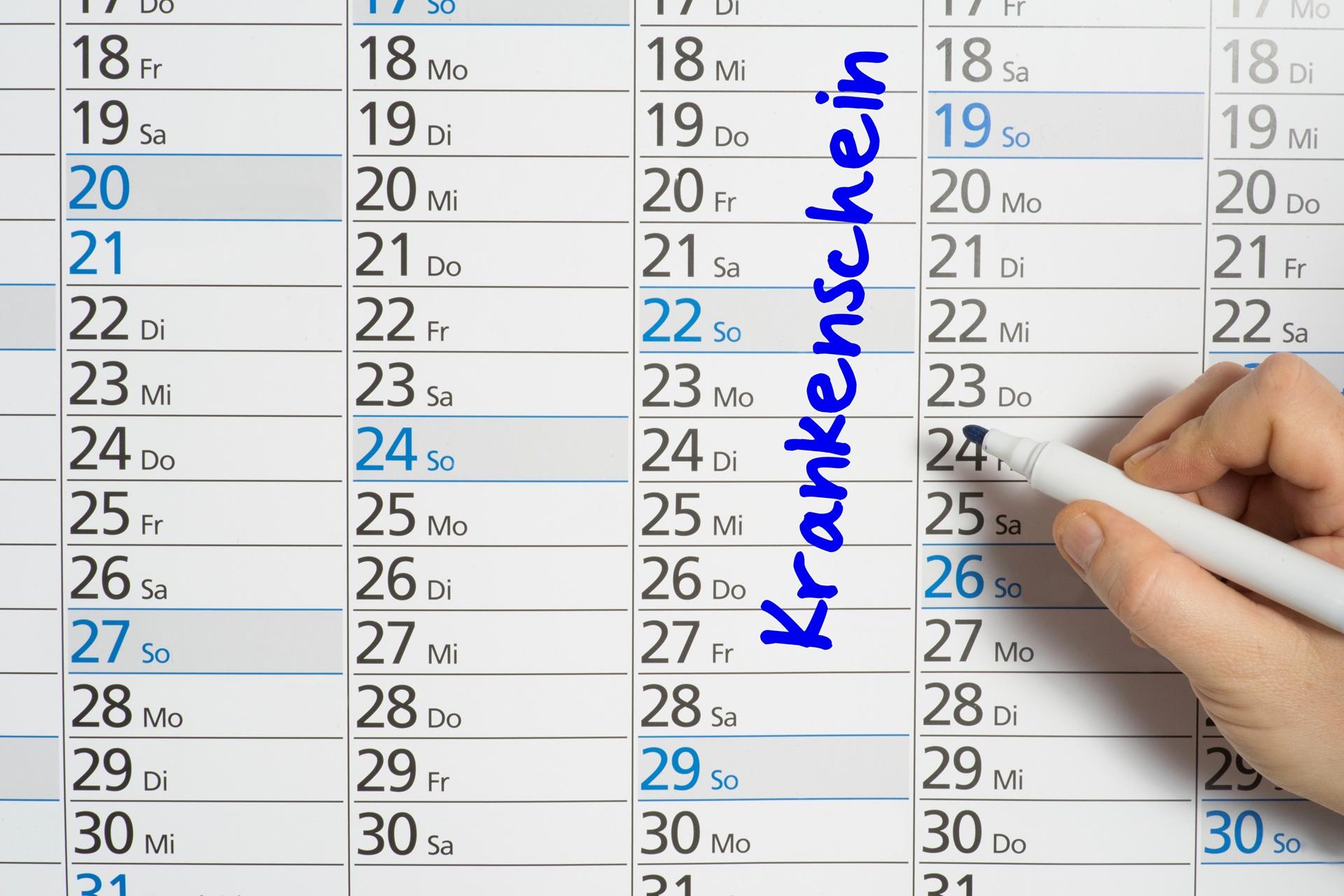 Hand schreibt Krankenschein in Kalender | betriebliche Gesundheitsförderung